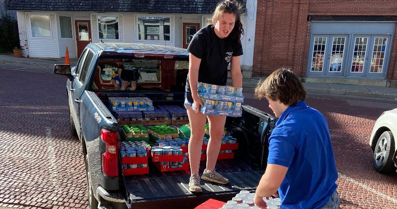 Saving Grace Outreach volunteers prepare to deliver food to residents in need.